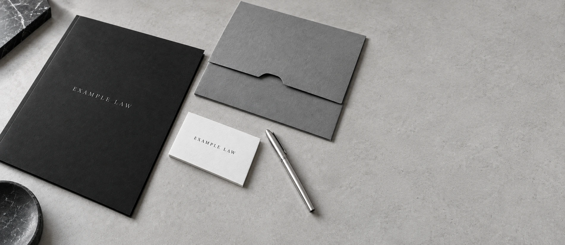 Example Law stationery with silver pen and charcoal legal folder